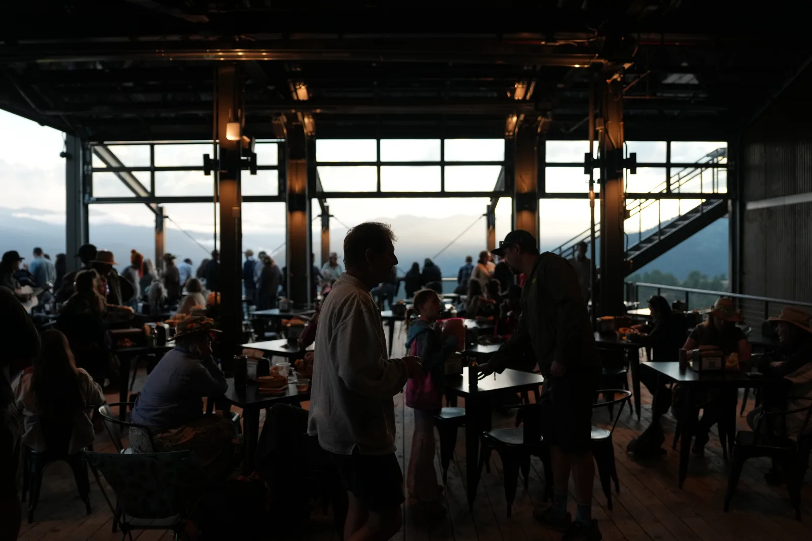 The Gold Bar at the Outpost — the main room, with the canyon beyond the glass